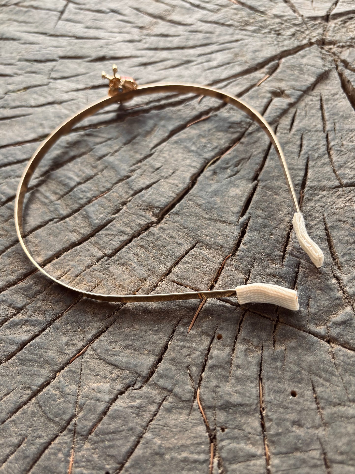 Gold headband with ladybug decoration