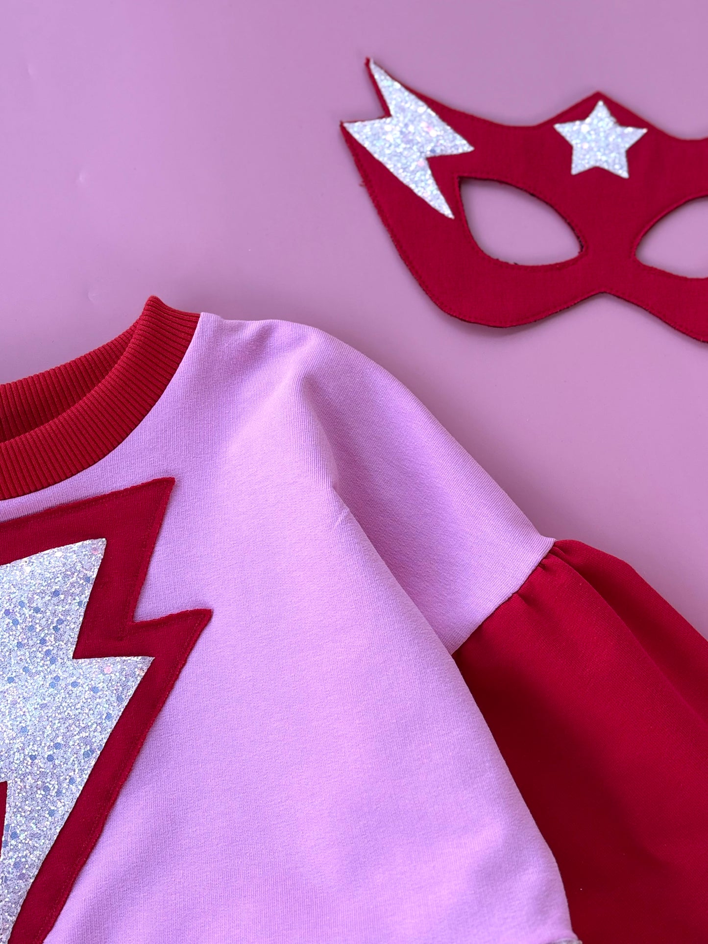 Supergirl red-pink dress