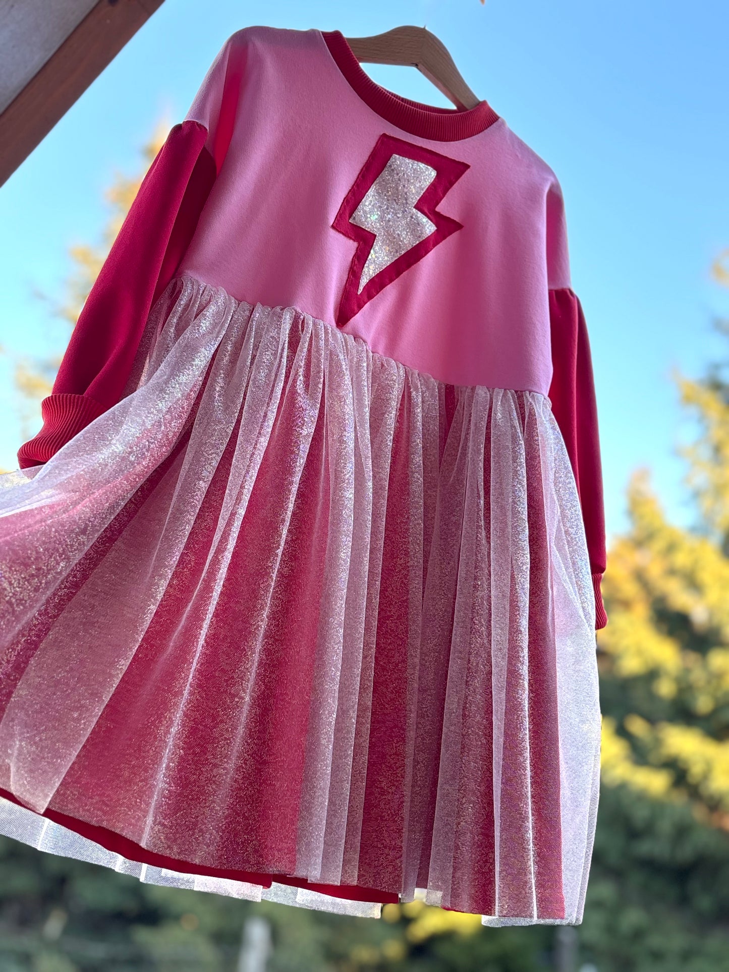 Supergirl red-pink dress