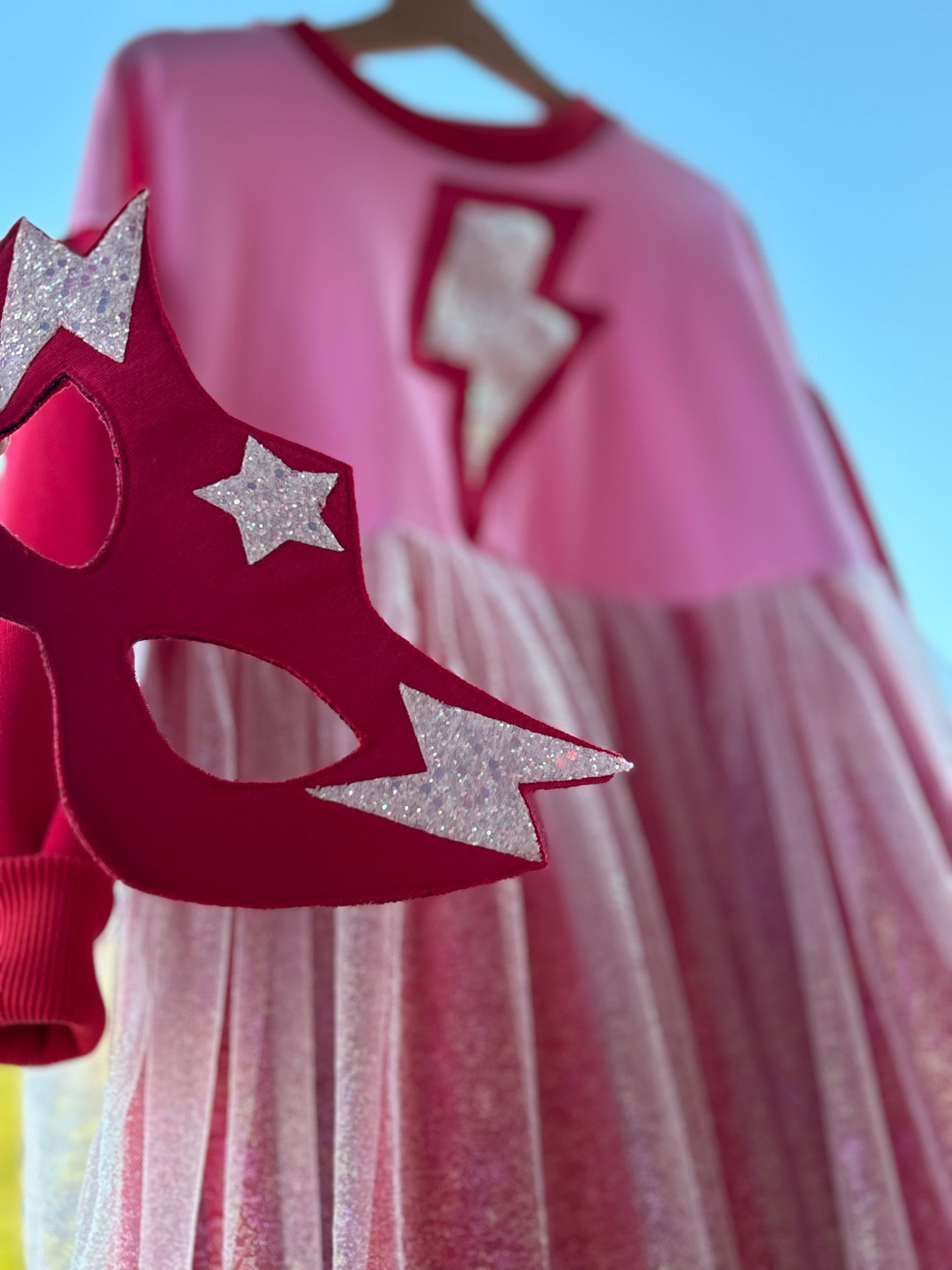 Supergirl red-pink dress