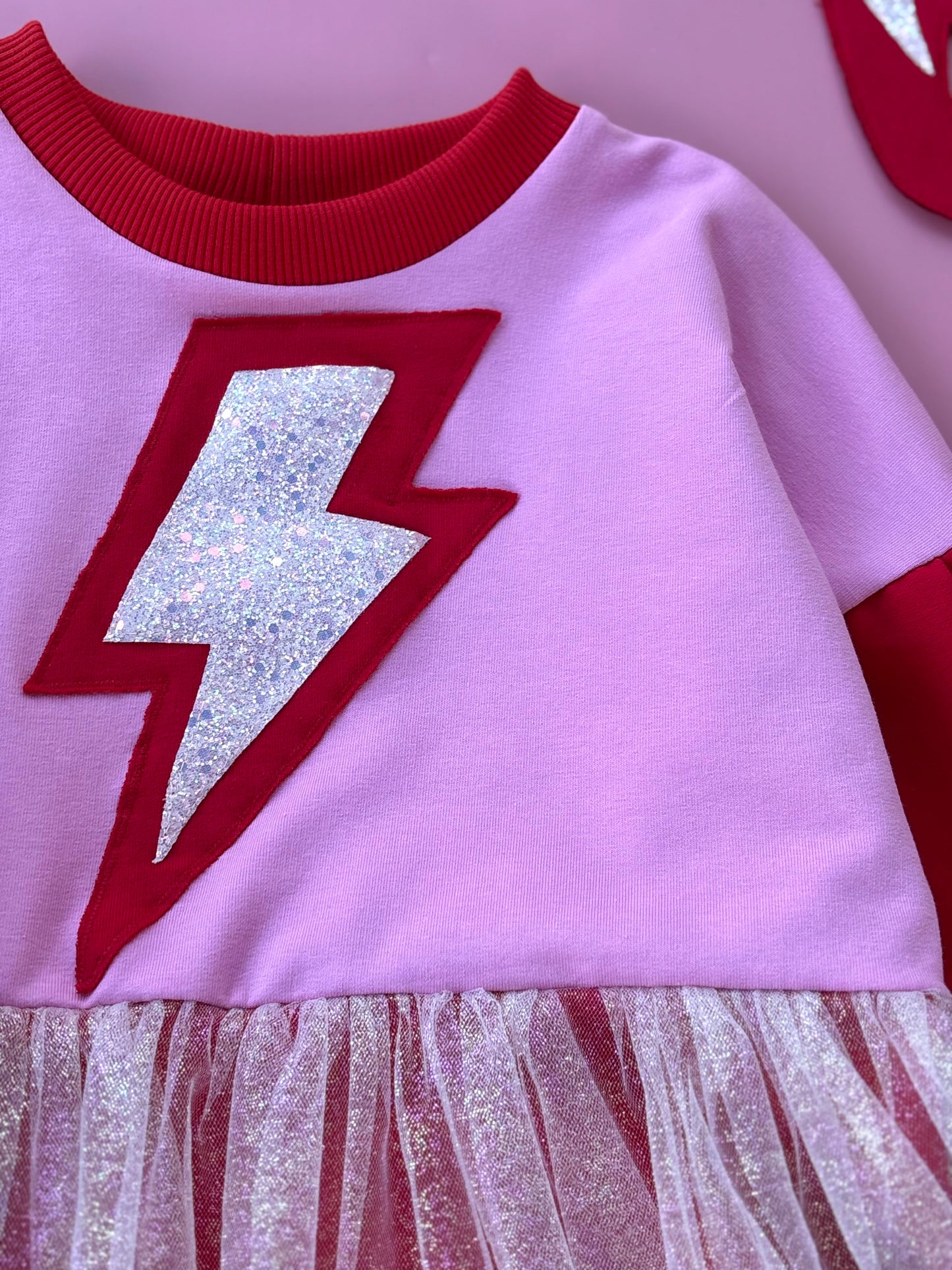 Supergirl red-pink dress